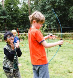 Child doing archery at a Premier Education Holiday Camp 1