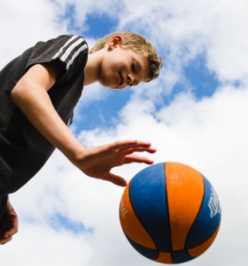 Child playing basketball at a Premier Education Holiday Camp 3