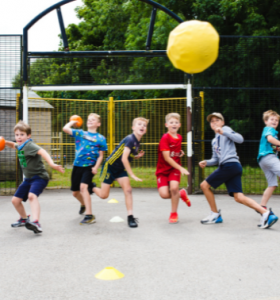 Children playing dodgeball at a Premier Education Holiday Camp