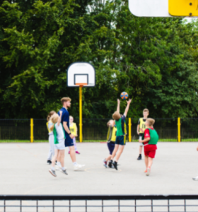 Children playing a game of netball at a Premier Education Holiday Camp