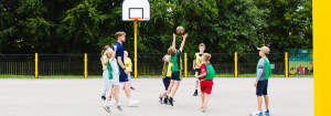 Children playing basketball at a Premier Education Holiday Camp 1 1