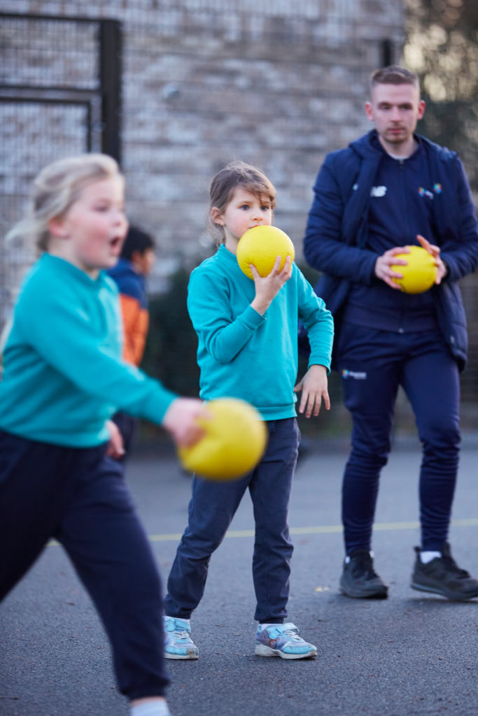 Children playing dodgeball at an afterschool club