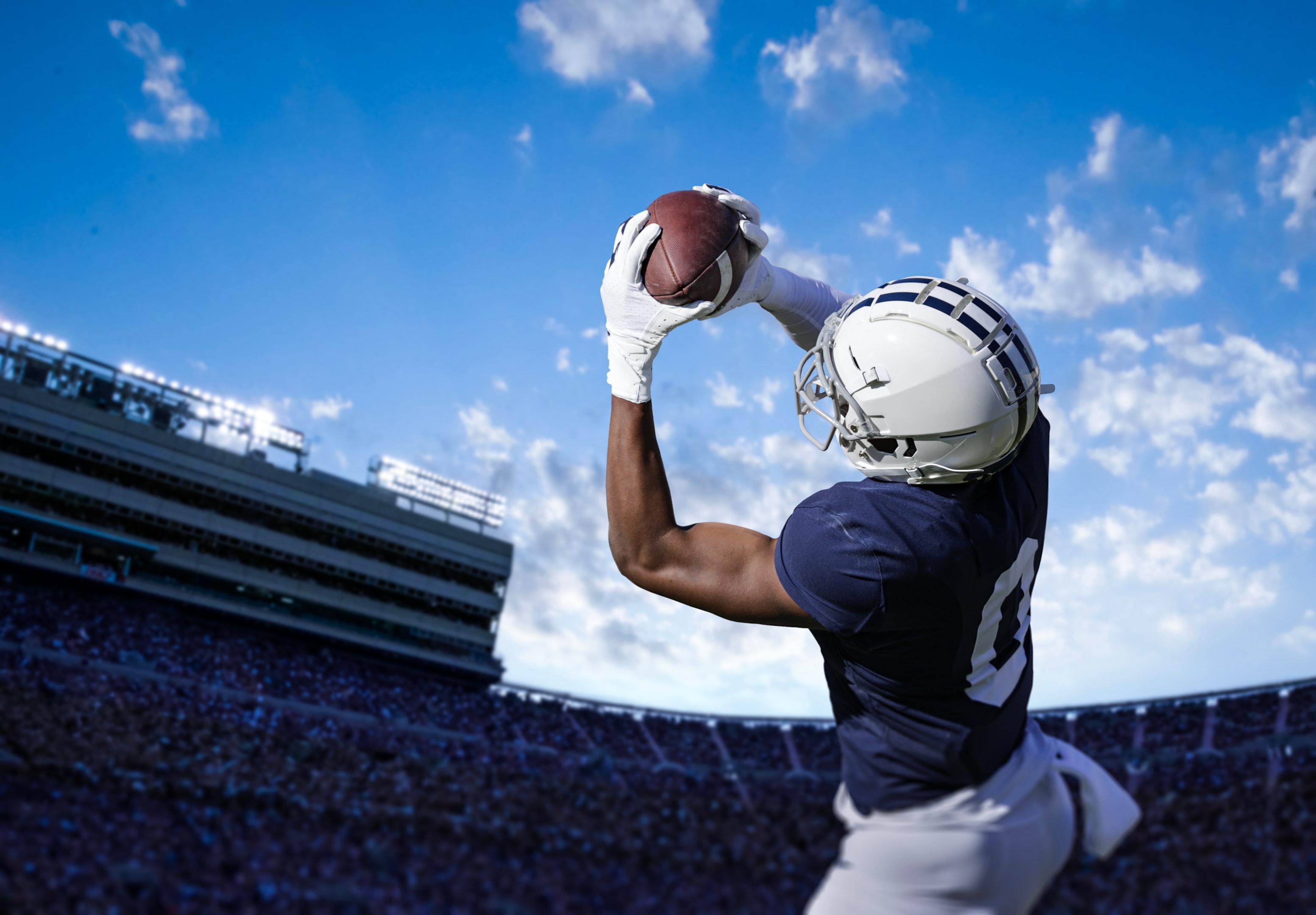The Most Popular Sports Across the World 2 Man playing American football in a stadium