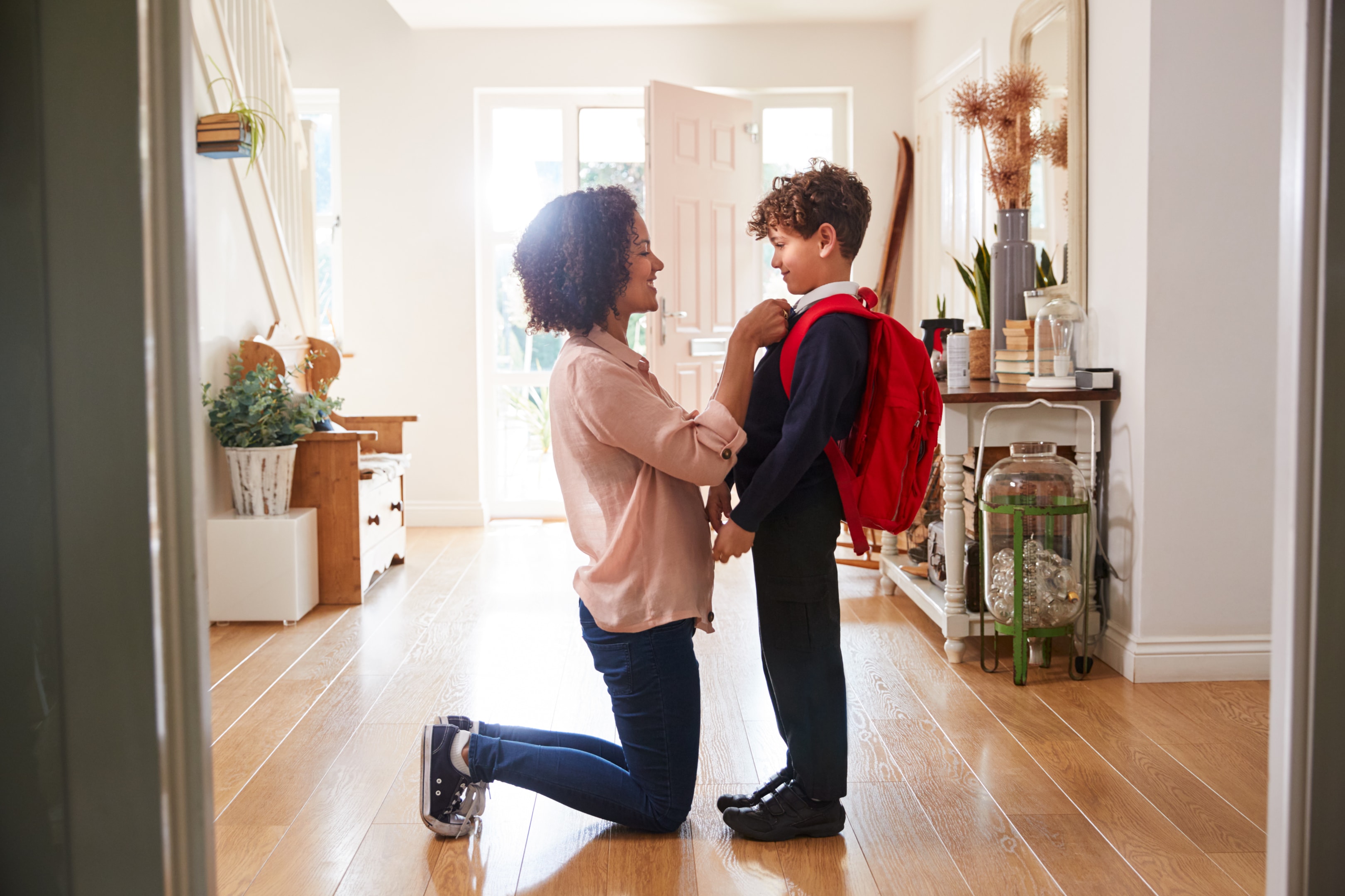 Mum getting child ready for school in the morning