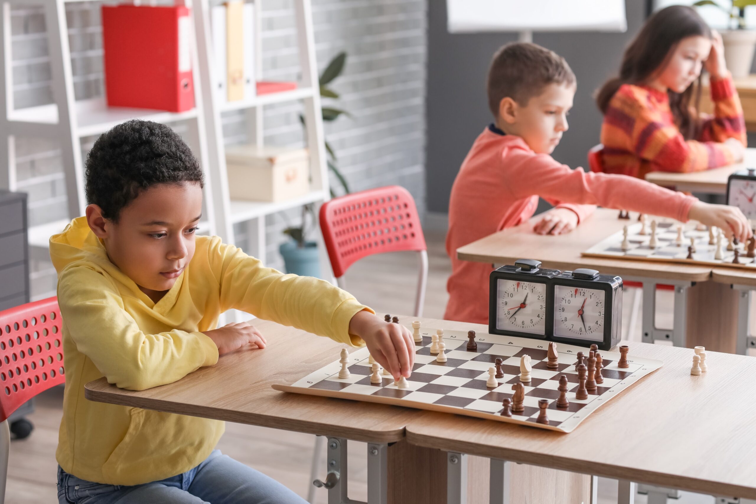 Extended Day Services that Premier Education Offers 2 Child playing chess at an after school club